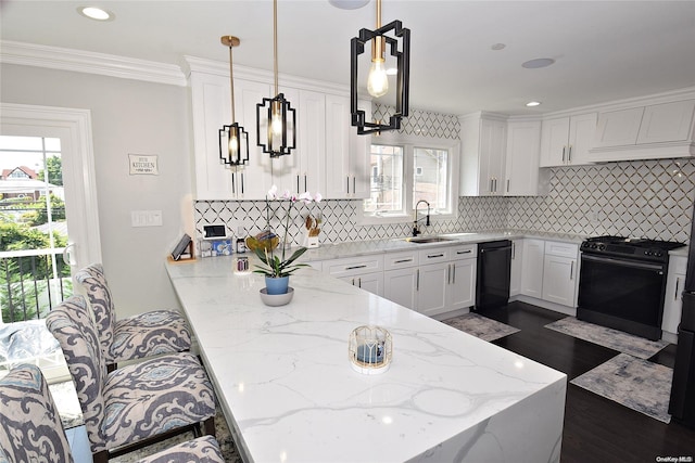 kitchen featuring white cabinets, black appliances, sink, hanging light fixtures, and light stone counters