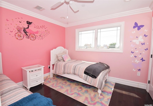 bedroom featuring ceiling fan, crown molding, and wood-type flooring