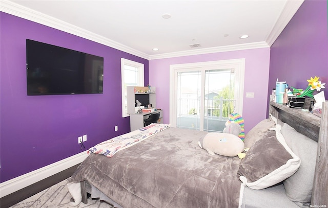 bedroom with wood-type flooring, ornamental molding, and access to outside