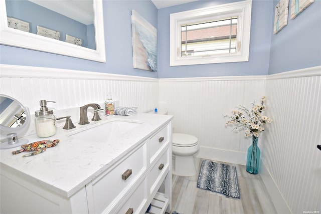 bathroom featuring toilet and vanity