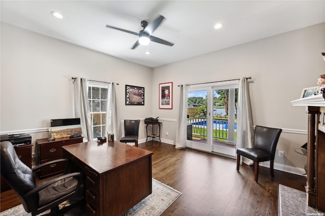 office with ceiling fan and dark wood-type flooring