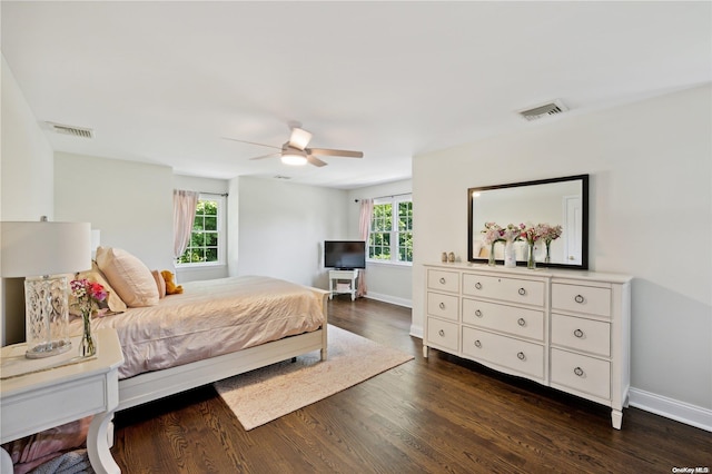bedroom featuring ceiling fan and dark hardwood / wood-style flooring
