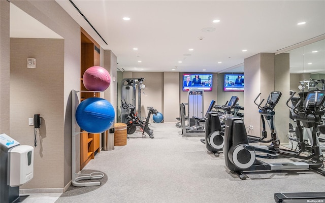 workout area featuring light colored carpet