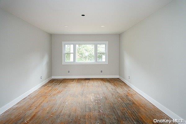 127 Berkshire Rd, Rockville Centre, NY 11570 - empty room featuring wood finished floors and recessed lighting