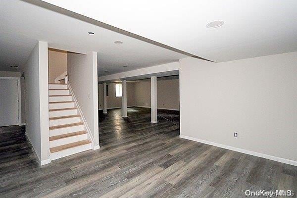 basement featuring dark hardwood / wood-style floors