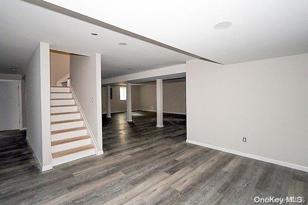127 Berkshire Rd, Rockville Centre, NY 11570 - basement featuring stairs and wood finished floors