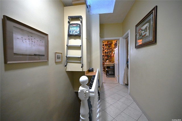 corridor with light tile patterned floors