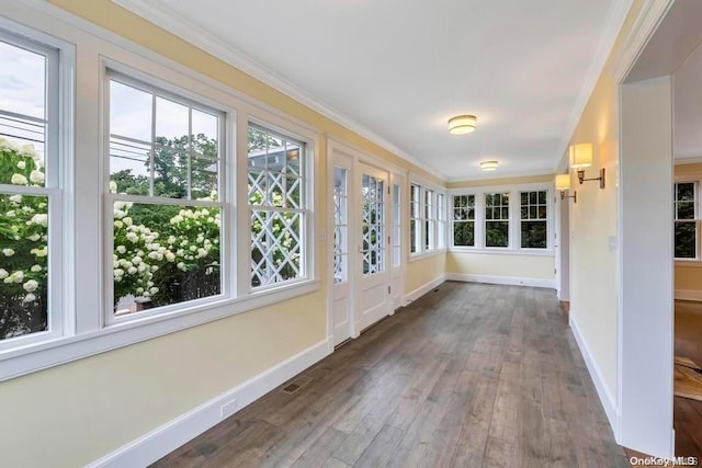 unfurnished sunroom featuring plenty of natural light