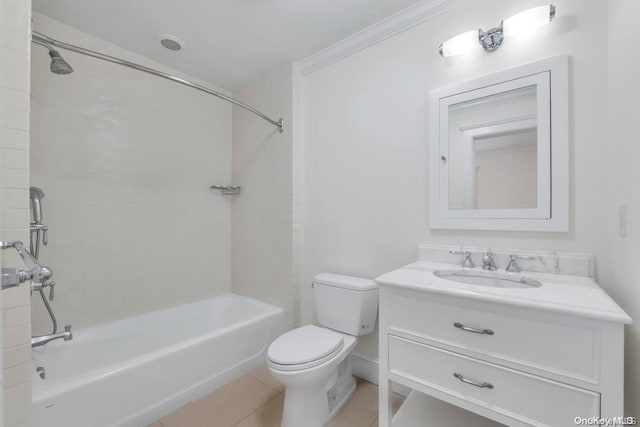 full bathroom with vanity, tile patterned floors, tiled shower / bath combo, toilet, and ornamental molding