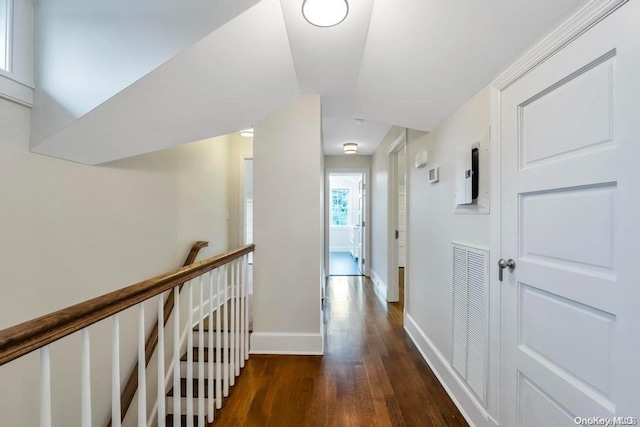 hall with dark hardwood / wood-style flooring