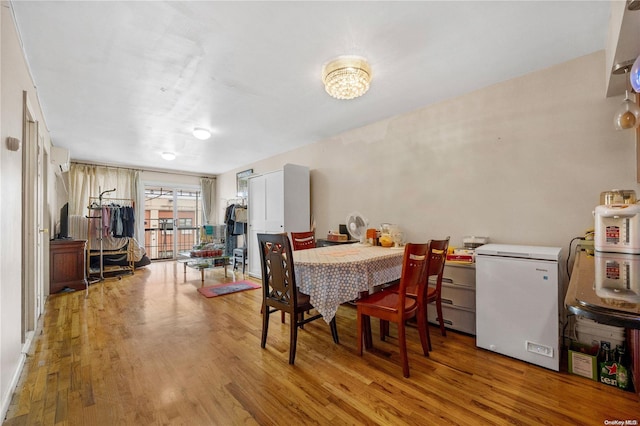 dining area with light hardwood / wood-style floors