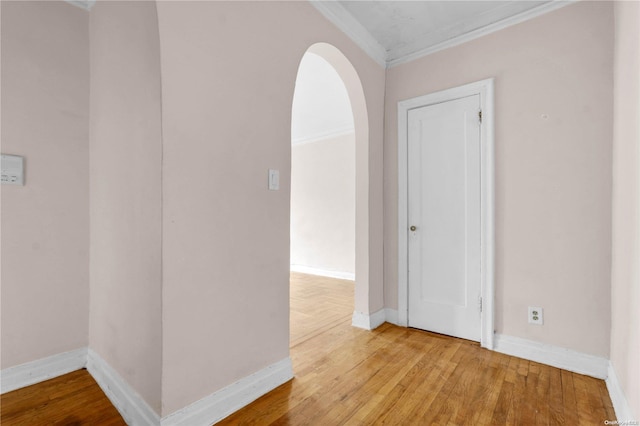 unfurnished room featuring hardwood / wood-style floors and ornamental molding