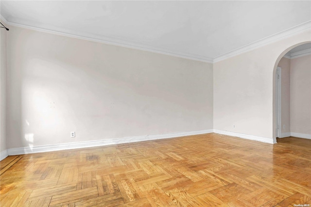 unfurnished room with light parquet floors and ornamental molding