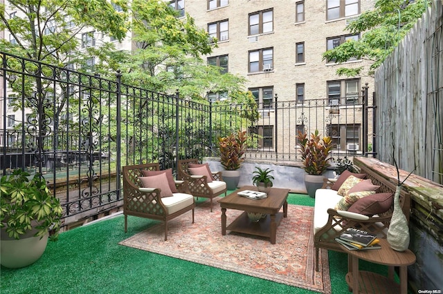 balcony with an outdoor hangout area and a patio