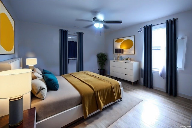 bedroom featuring ceiling fan and hardwood / wood-style flooring