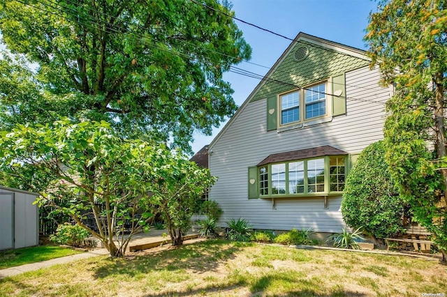 view of property exterior featuring a yard