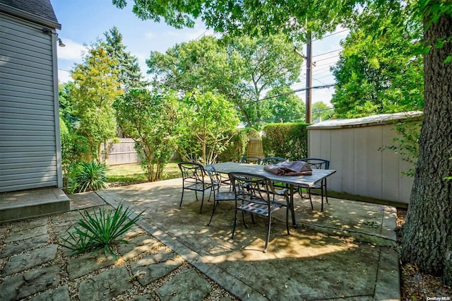 view of patio / terrace with a shed