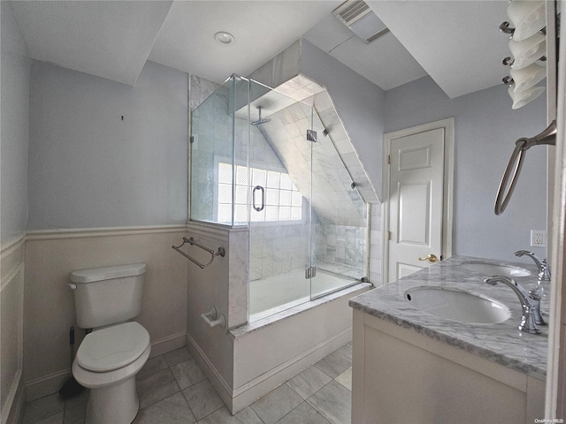 full bathroom with vanity, toilet, and bath / shower combo with glass door