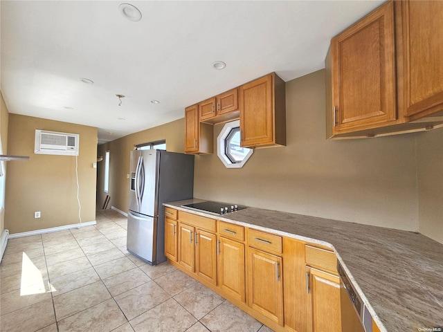 kitchen featuring a wall unit AC, stainless steel fridge with ice dispenser, black electric stovetop, and light tile patterned floors