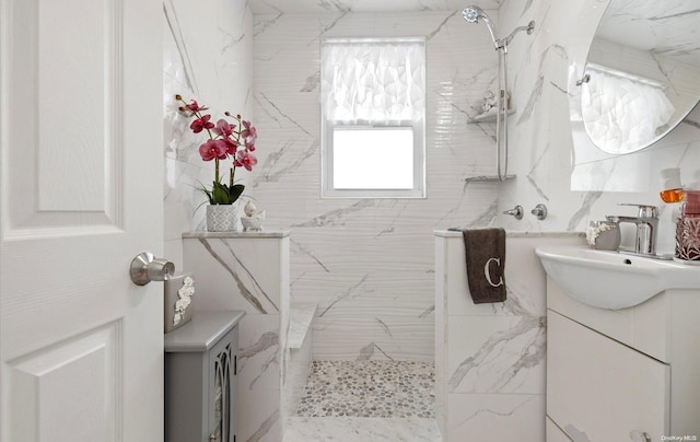 bathroom featuring vanity and a tile shower