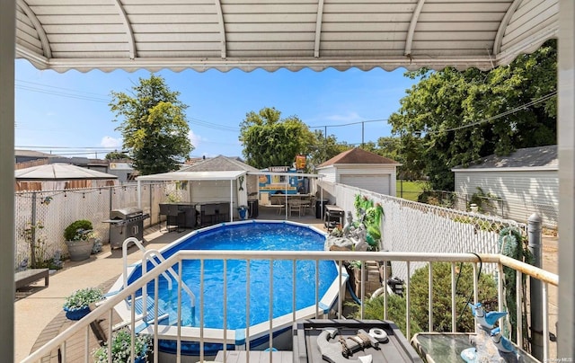 view of swimming pool with area for grilling