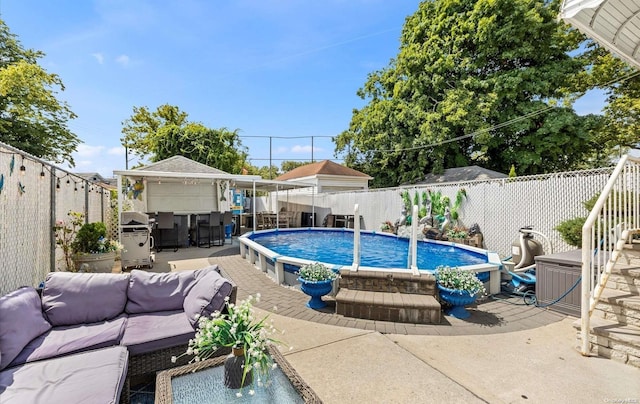 view of swimming pool with area for grilling, an outdoor hangout area, and a patio