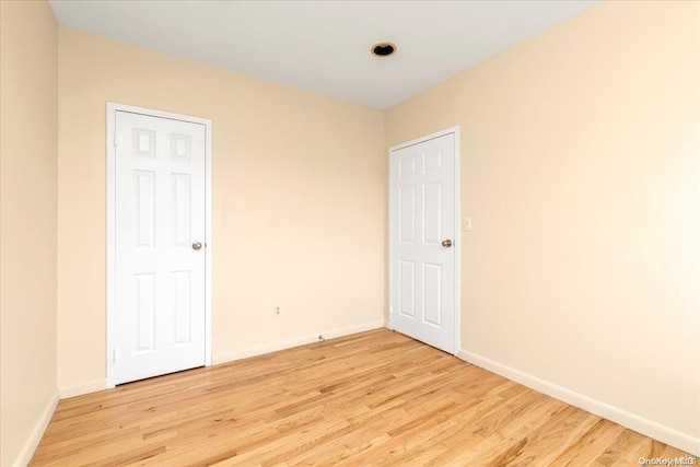 unfurnished bedroom featuring light wood-type flooring