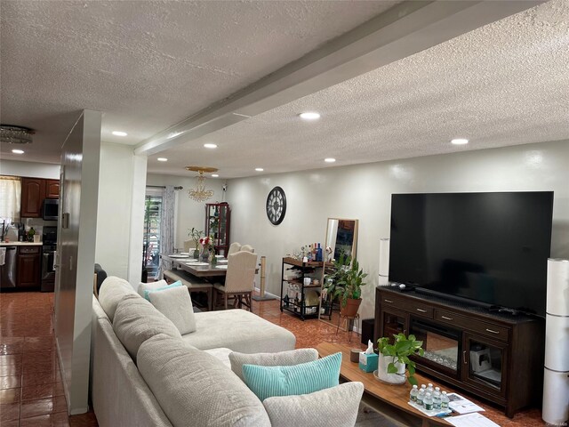 living room featuring tile patterned flooring and a textured ceiling