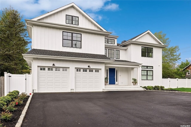 modern inspired farmhouse with a garage