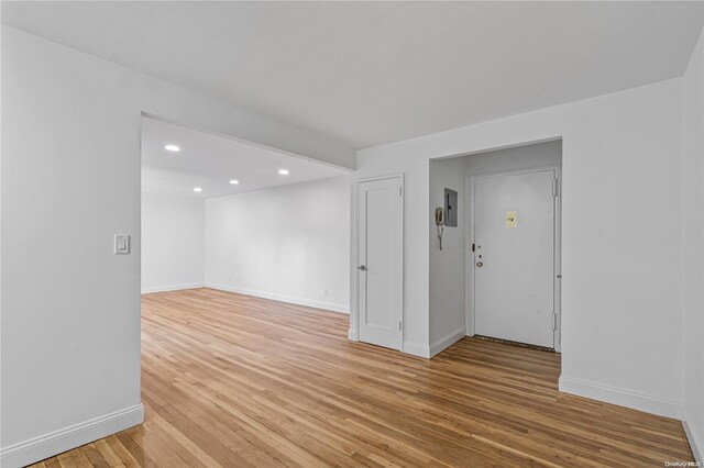 unfurnished room featuring light wood-type flooring