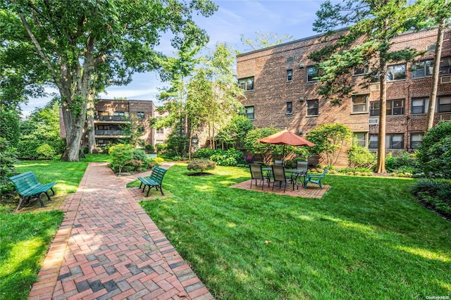 view of property's community with a lawn