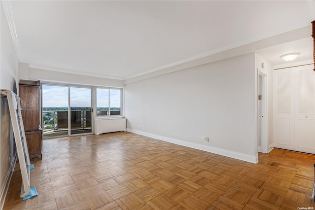 unfurnished living room with ornamental molding, radiator heating unit, and light parquet flooring