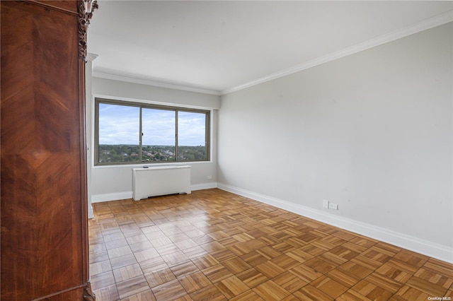 empty room featuring radiator, light parquet floors, and ornamental molding