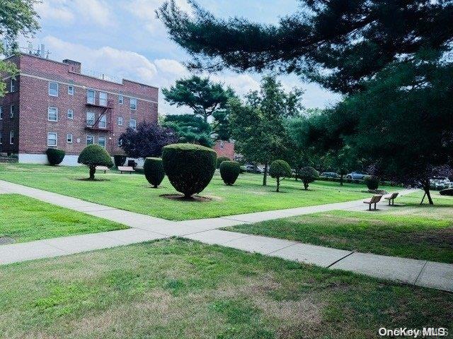 view of home's community featuring a lawn