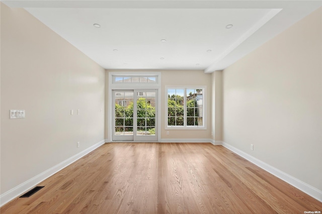 unfurnished room with light hardwood / wood-style flooring