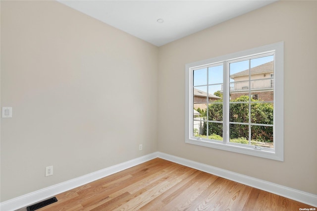 spare room with light hardwood / wood-style floors