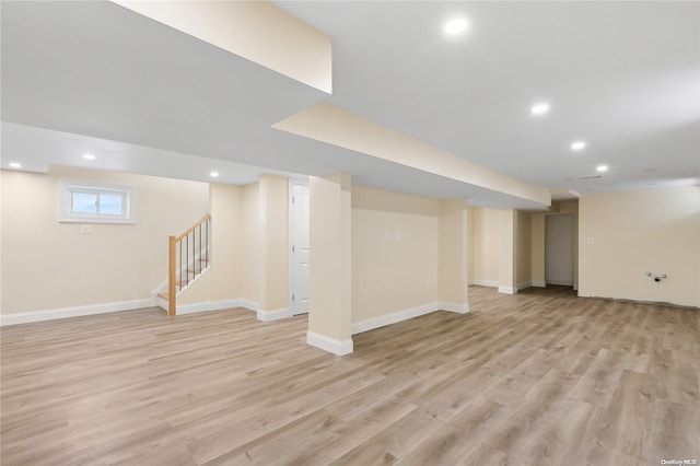 basement featuring light wood-type flooring