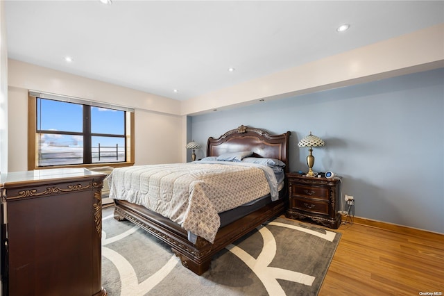 bedroom with light hardwood / wood-style floors