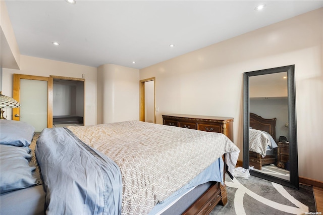 bedroom featuring hardwood / wood-style flooring