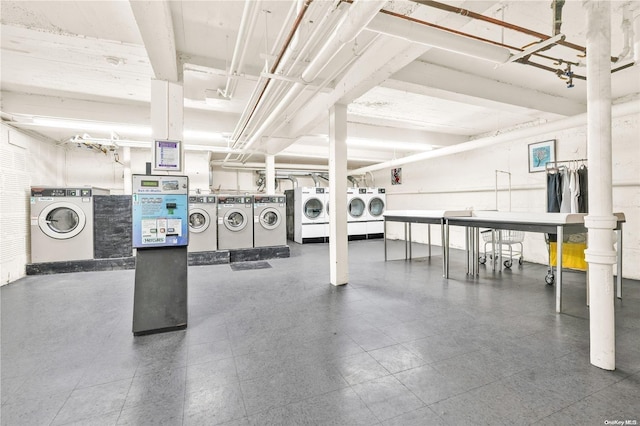 clothes washing area with washing machine and clothes dryer