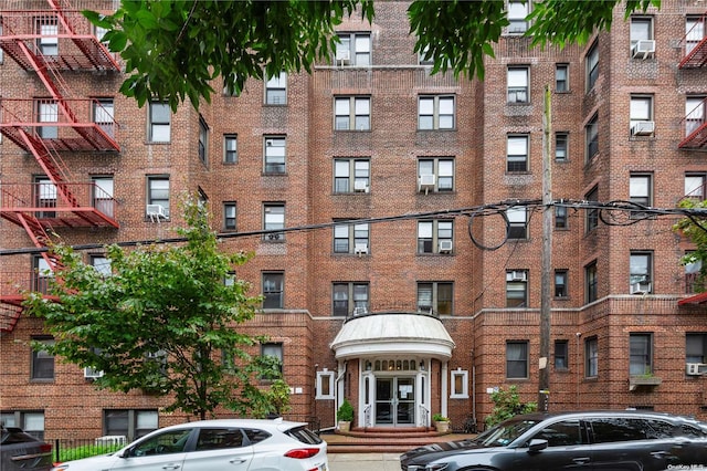 view of building exterior with cooling unit