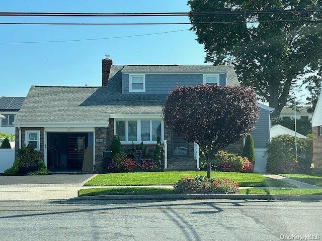 view of front of home with a front yard