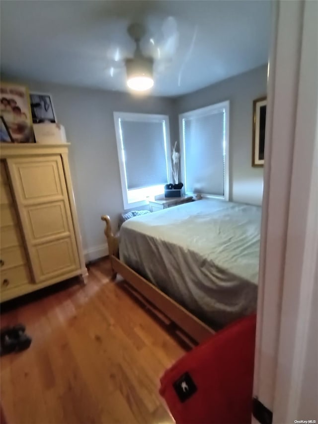 bedroom featuring ceiling fan and light hardwood / wood-style floors