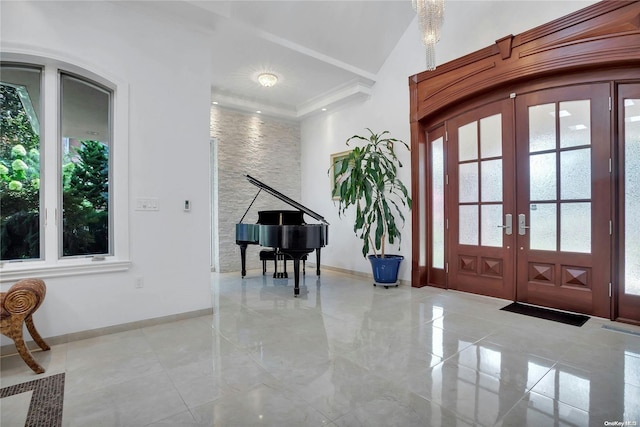 entryway featuring french doors and lofted ceiling