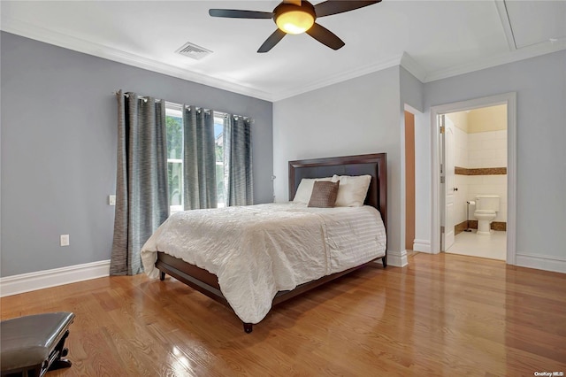 bedroom with light wood-type flooring, ensuite bath, ceiling fan, and ornamental molding