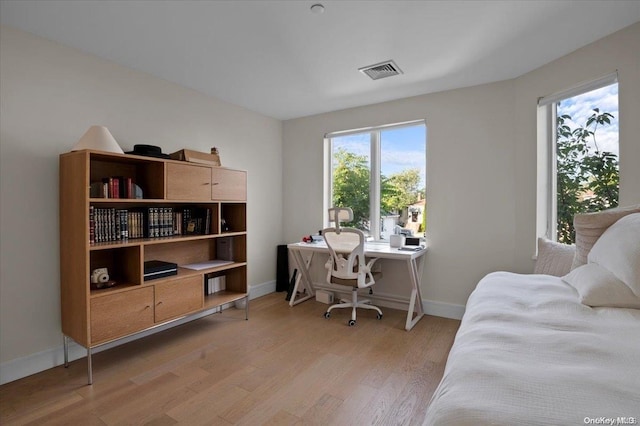 office area with light hardwood / wood-style flooring