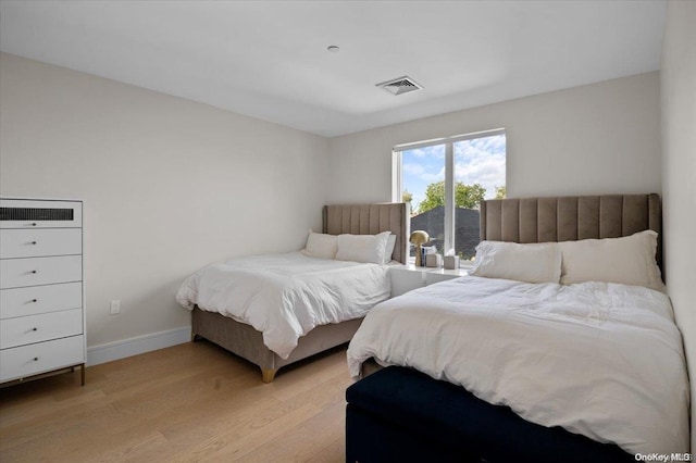 bedroom featuring light hardwood / wood-style floors