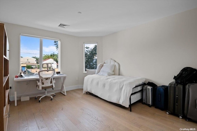 bedroom featuring light wood-type flooring