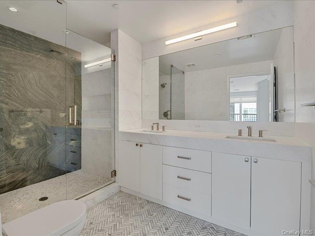 bathroom with walk in shower, vanity, and toilet