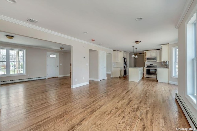 unfurnished living room featuring crown molding, a baseboard radiator, and light wood-type flooring